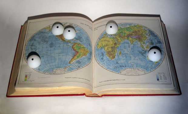 Five Eyes: 5 ping pong balls with felt tip dots embedded into a routed Encyclopedia Britannica volume (physical atlas entry) on Austrlia, Canada, New Zealand, UK, USA.    Kypros Kyprianou, 2014