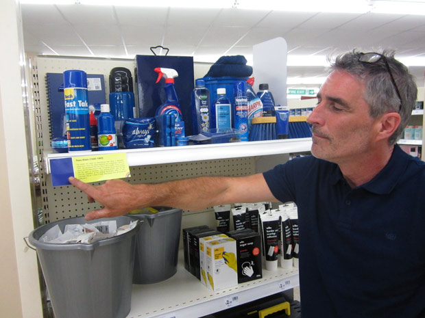 Johnathan pointing at Yves Klein shelf label