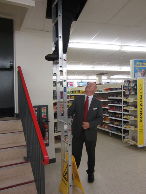 Manager Mike Cotterell inspecting the wobbly ladder