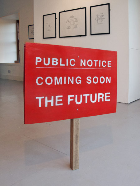 Futures (installation view): Coming Soon The Future - hand painted sign (foreground)  Impossible Cycles carbon paper diagrams (background)  ACA, Old Post Office, Allenheads 2011